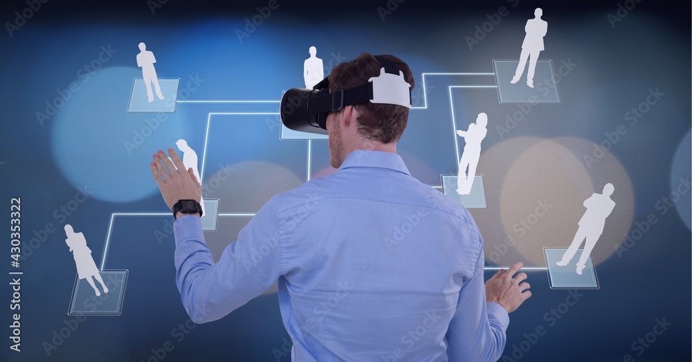 Composition of network of connections with people icons over man wearing vr headset touching screen