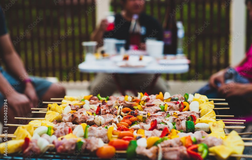 Delicious BBQ steaks on the grill and outdoor party at home.