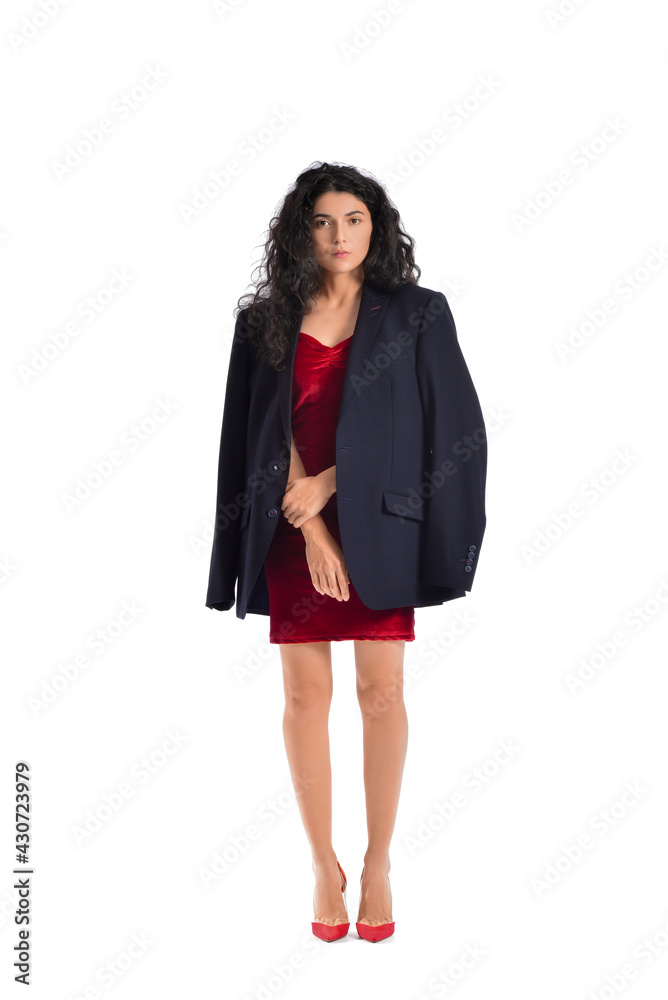 Beautiful young woman in jacket on white background