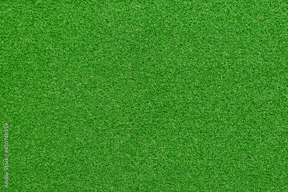 Flat green Artificial grass texture background. Short grass pattern.