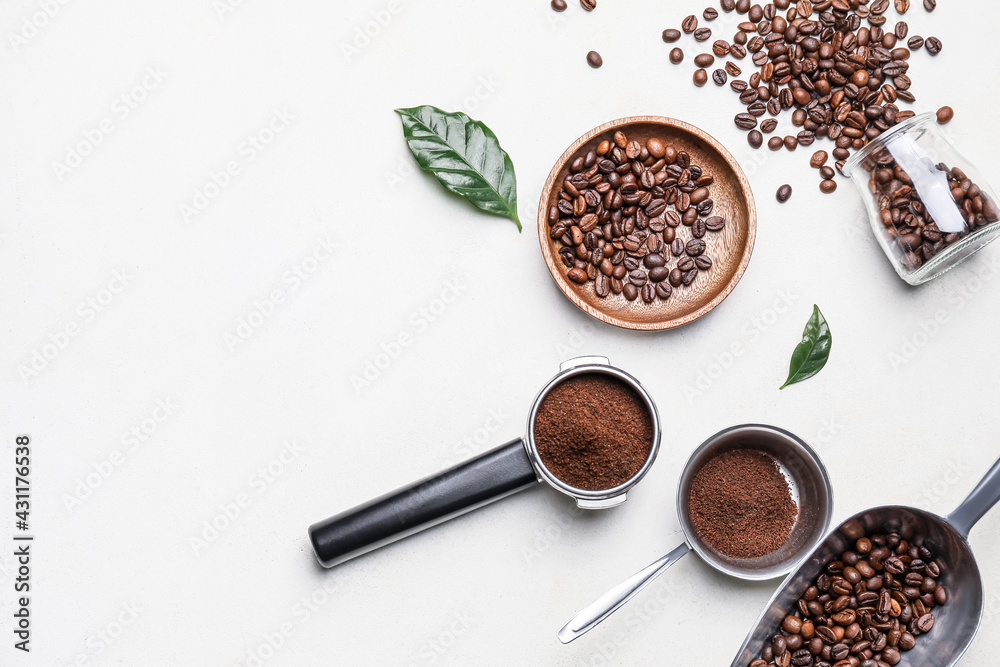 Composition with coffee beans and powder on light background