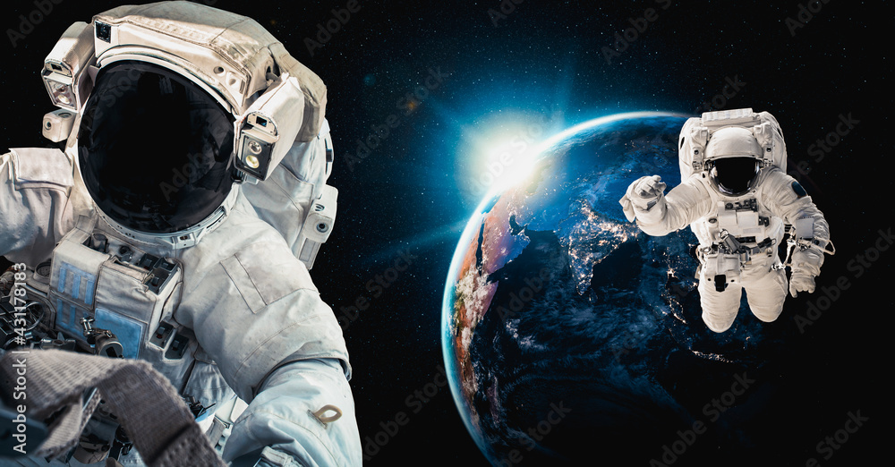 Astronaut spaceman do spacewalk while working for space station in outer space . Astronaut wear full