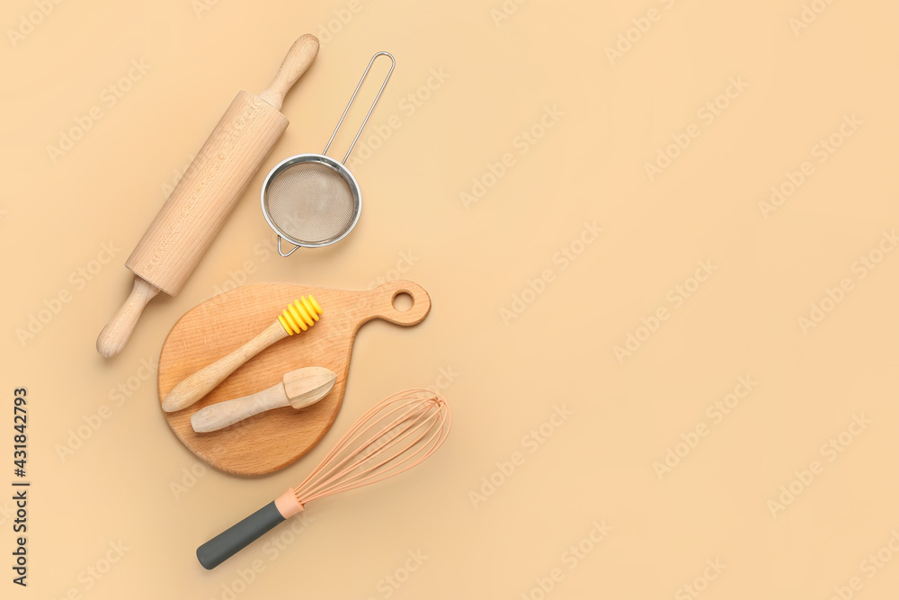 Set of kitchen utensils on color background