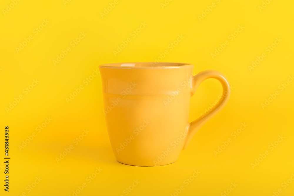 Stylish cup on color background