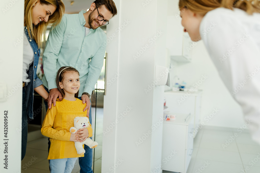 Parents and girl in meeting with doctor orthodontist, dental examination and dentist consultation.