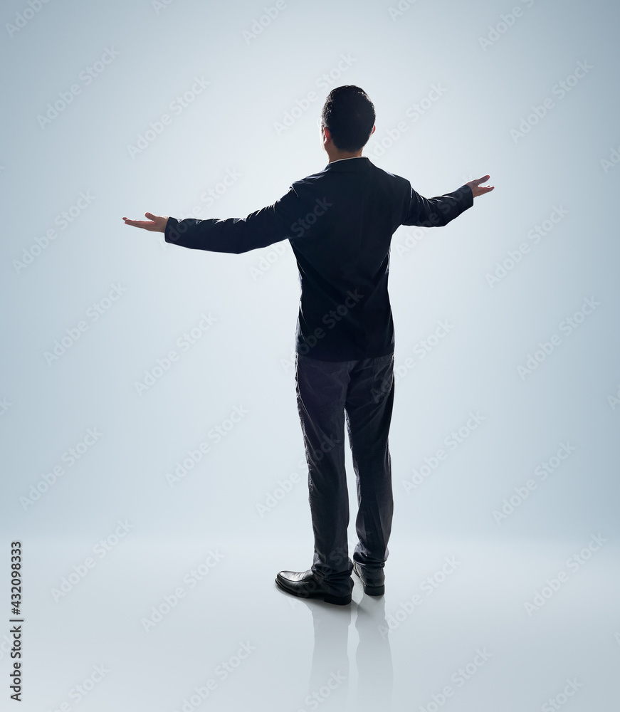 Rear view angle of Businessman standing and lift up the hands