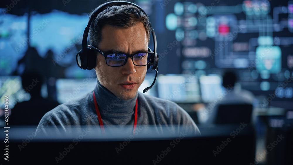 Portrait of Professional IT Technical Support Specialist Working on Computer in Monitoring Control R