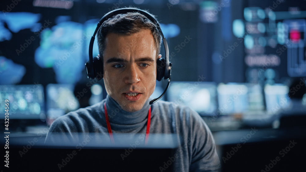 Portrait of Professional IT Technical Support Specialist Working on Computer in Monitoring Control R