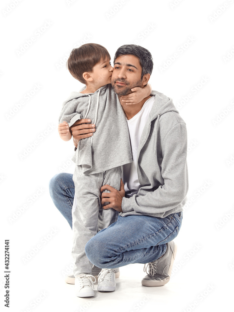 Happy father and his little son on white background