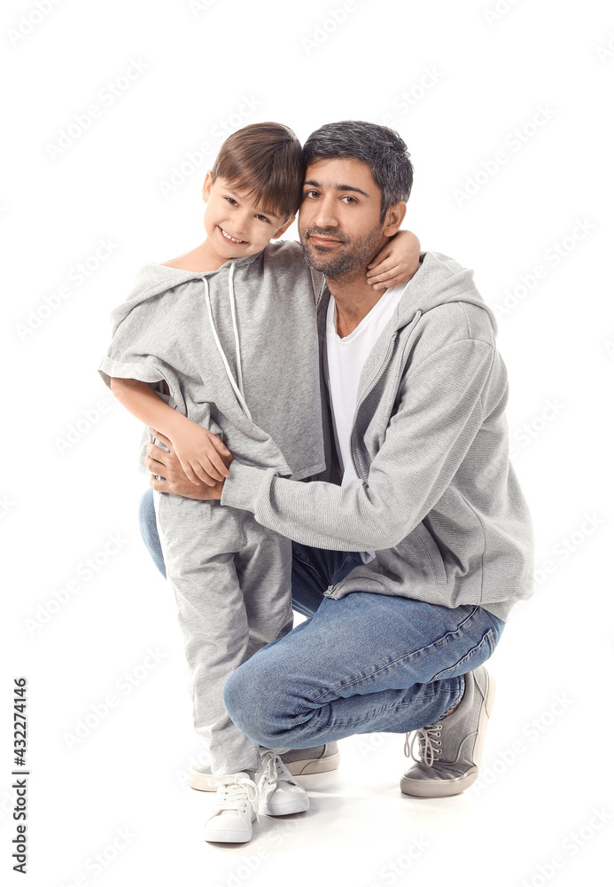 Happy father and his little son on white background