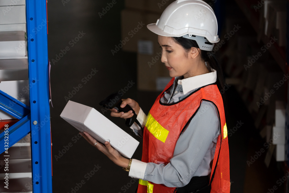 Female warehouse worker working at the storehouse . Logistics , supply chain and warehouse business 