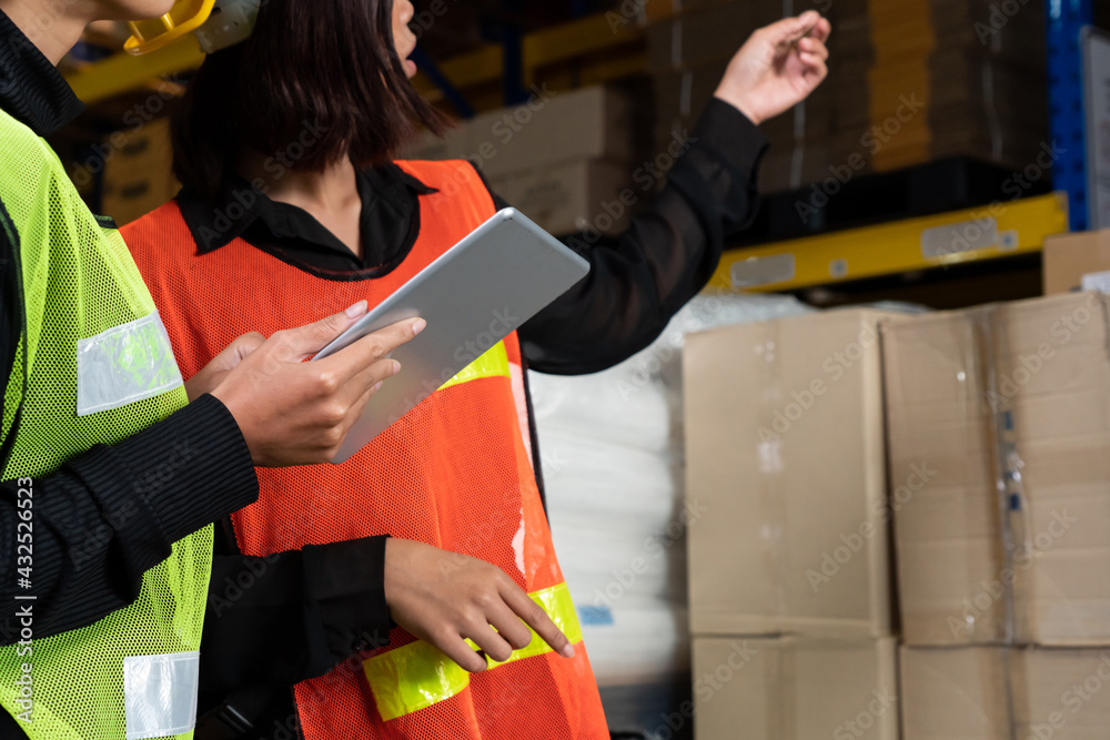 Female warehouse worker working at the storehouse . Logistics , supply chain and warehouse business 