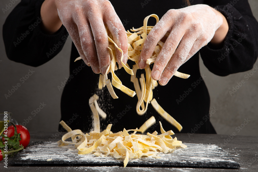 Italian pasta cooking process. Fresh food concept. Home made tagliatelle