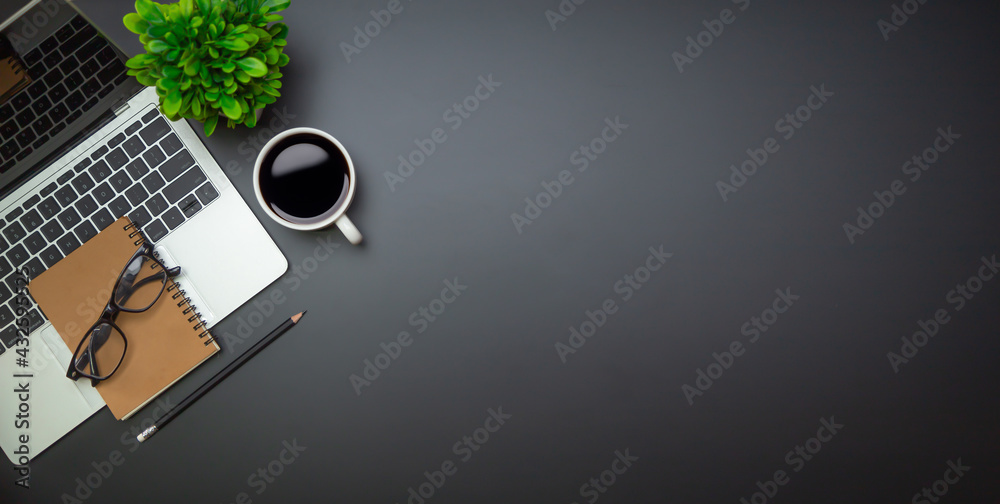 Workspace - Flat top view illustration of a workspace with a coffee cup and notebook on the black de