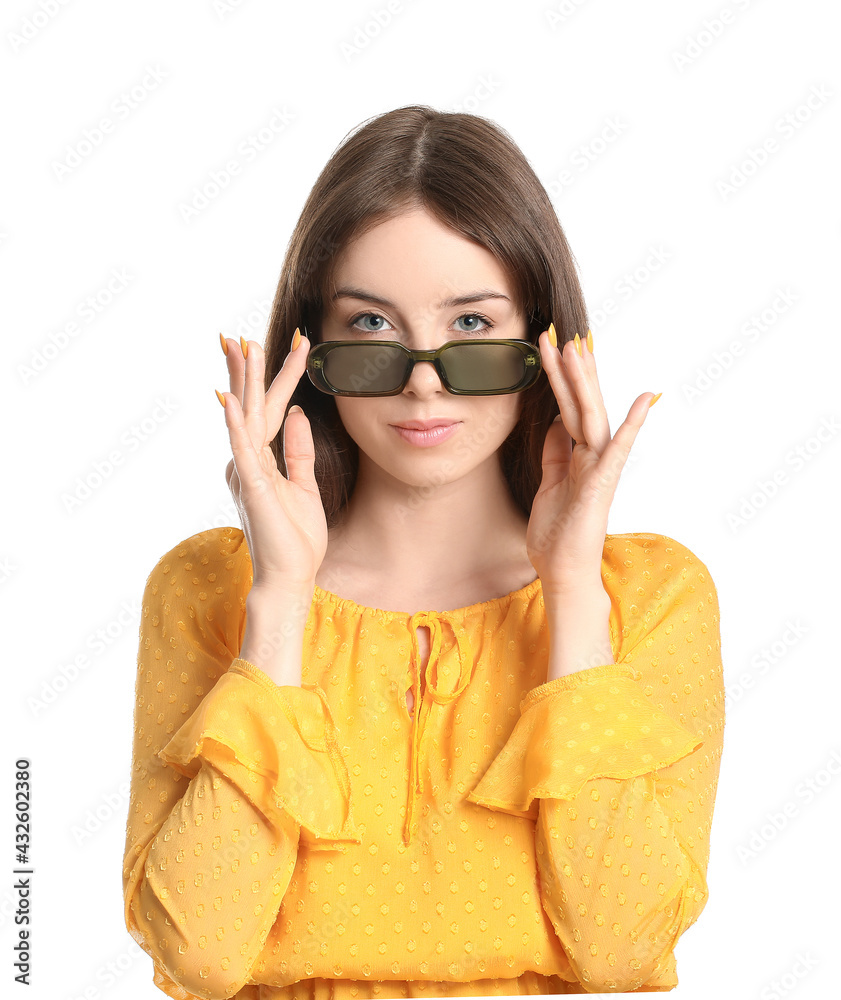 Beautiful young woman with stylish sunglasses on white background