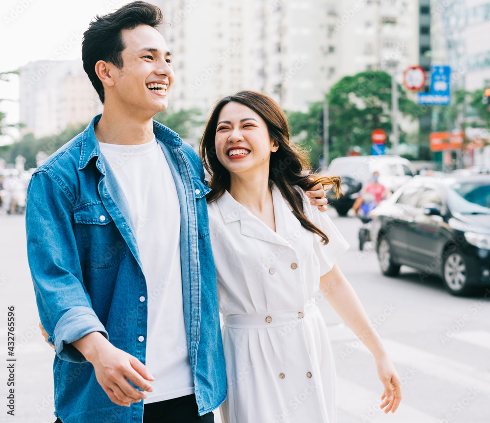 Young Asian couple walking on the street