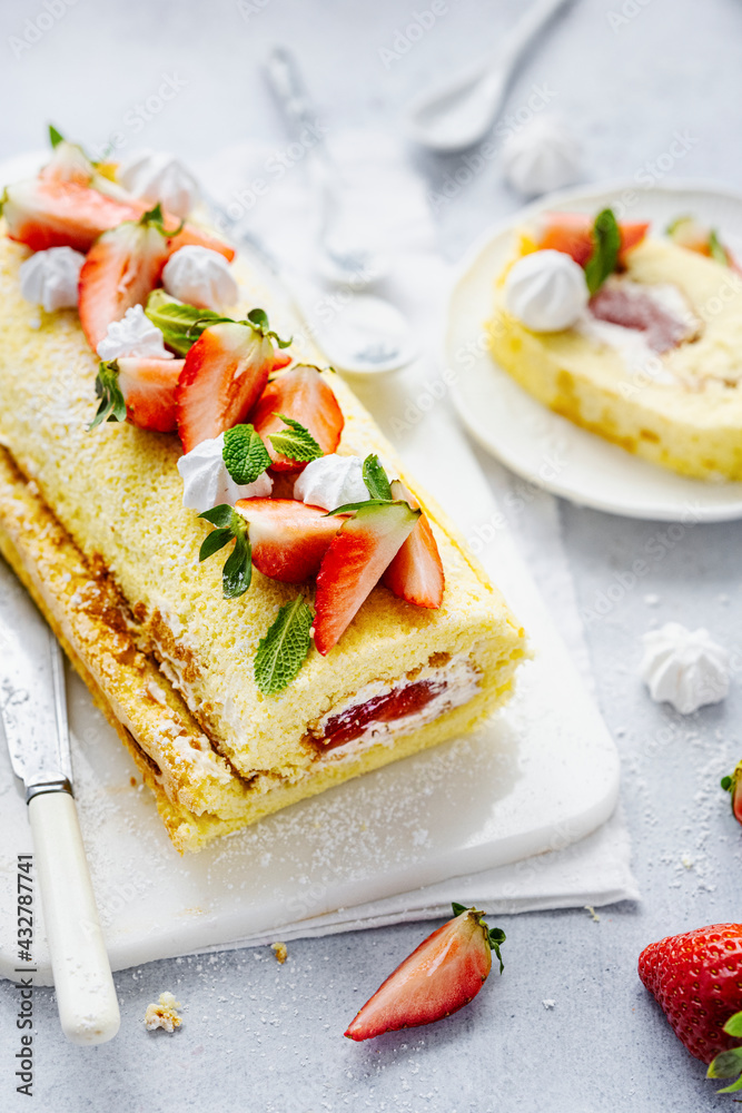 Fluffy strawberry Swiss roll food photography