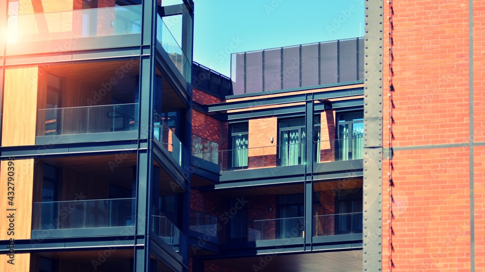 Architectural exterior detail of residential apartment building with brick facade. Modern brick and 