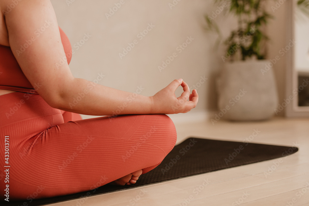 Woman meditating in lotus pose