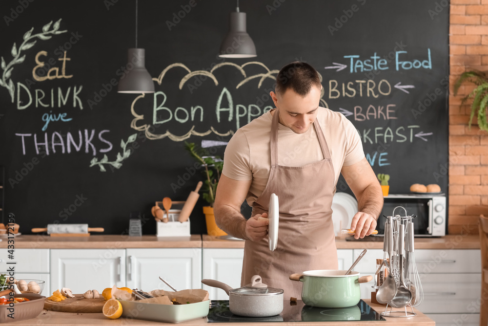 Young man cooking in kitchen