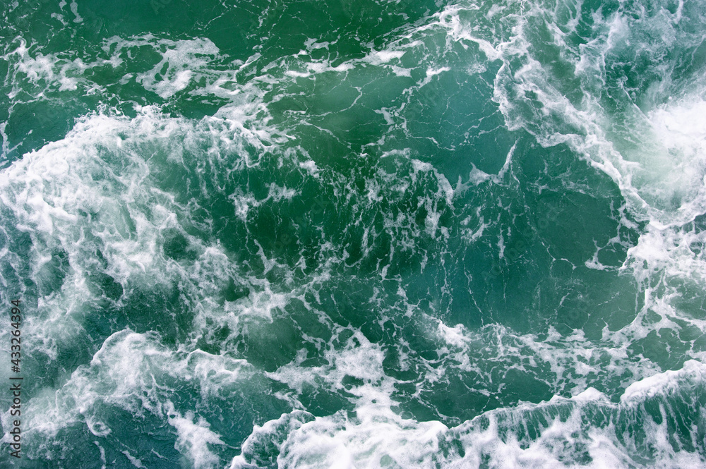 Aerial view to ocean waves.