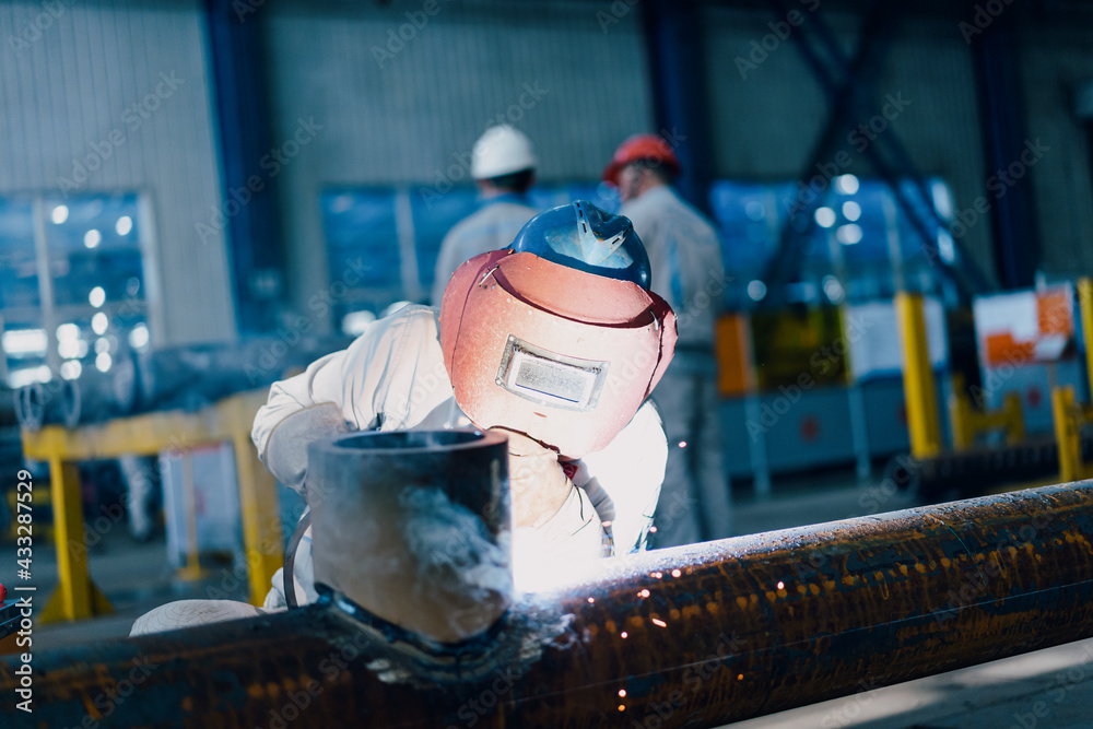 Welders working in the factory