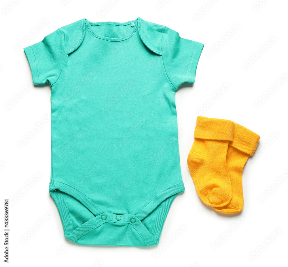 Baby clothes and socks on white background