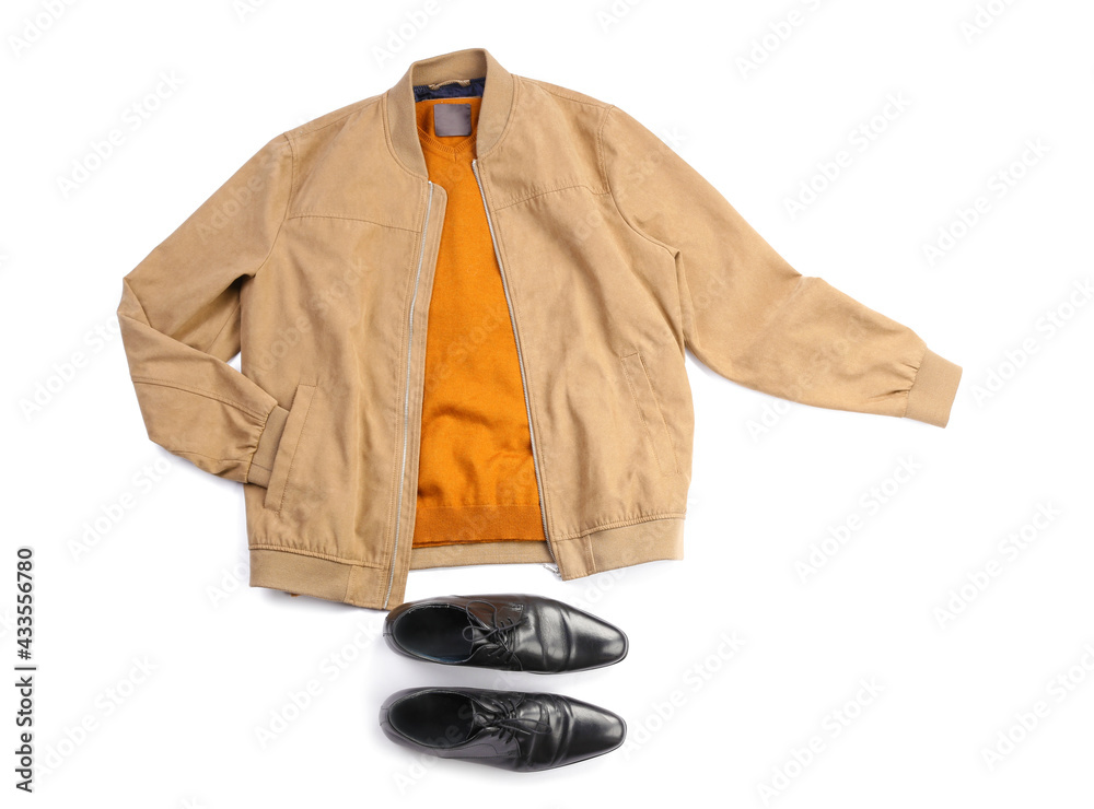 Stylish jacket, sweater and shoes on white background