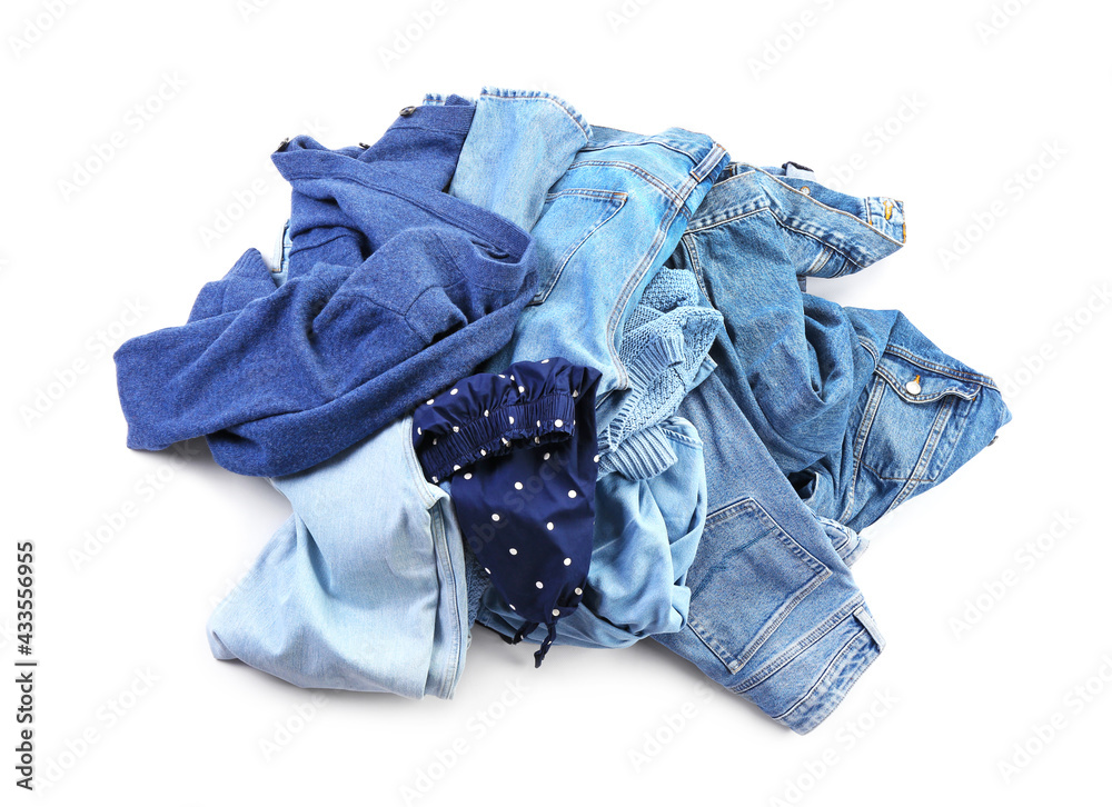 Heap of different clothes on white background