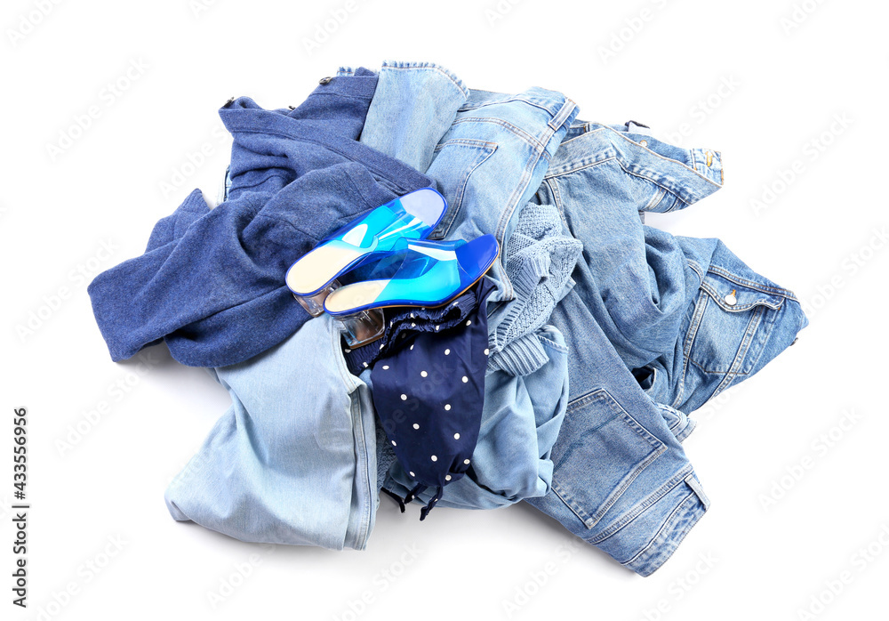 Heap of different clothes on white background