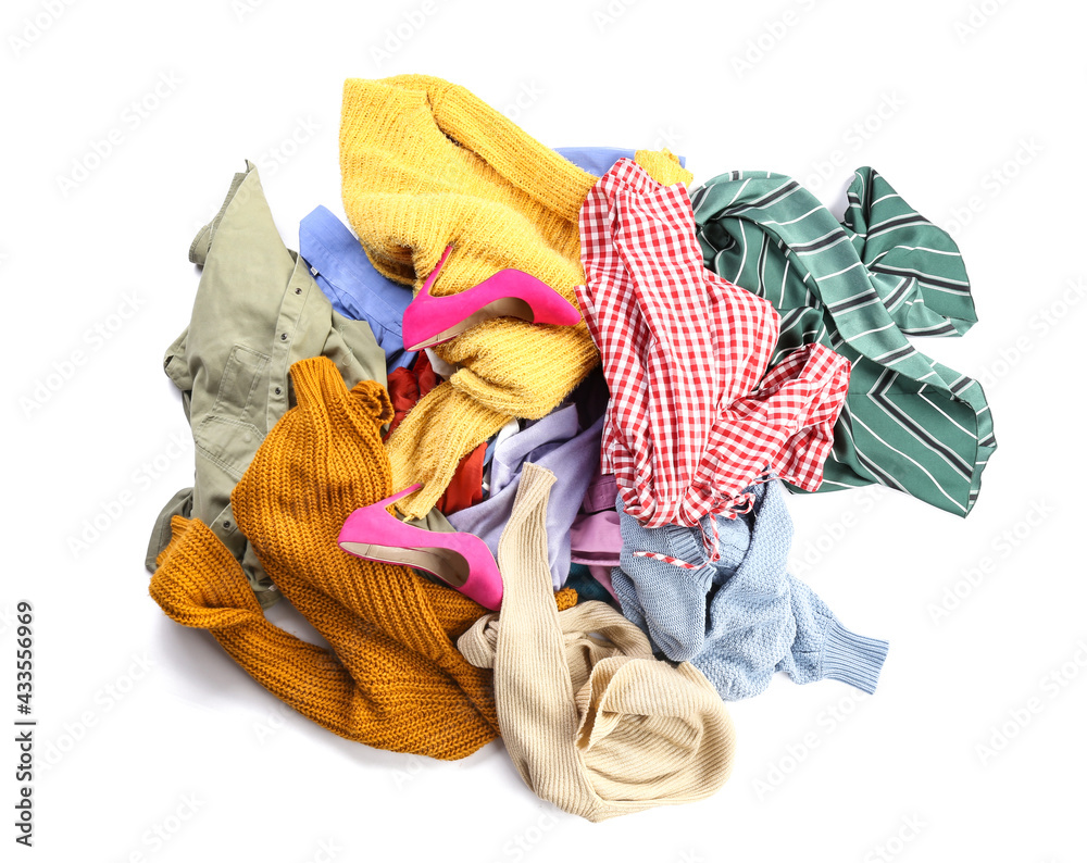 Heap of different clothes on white background