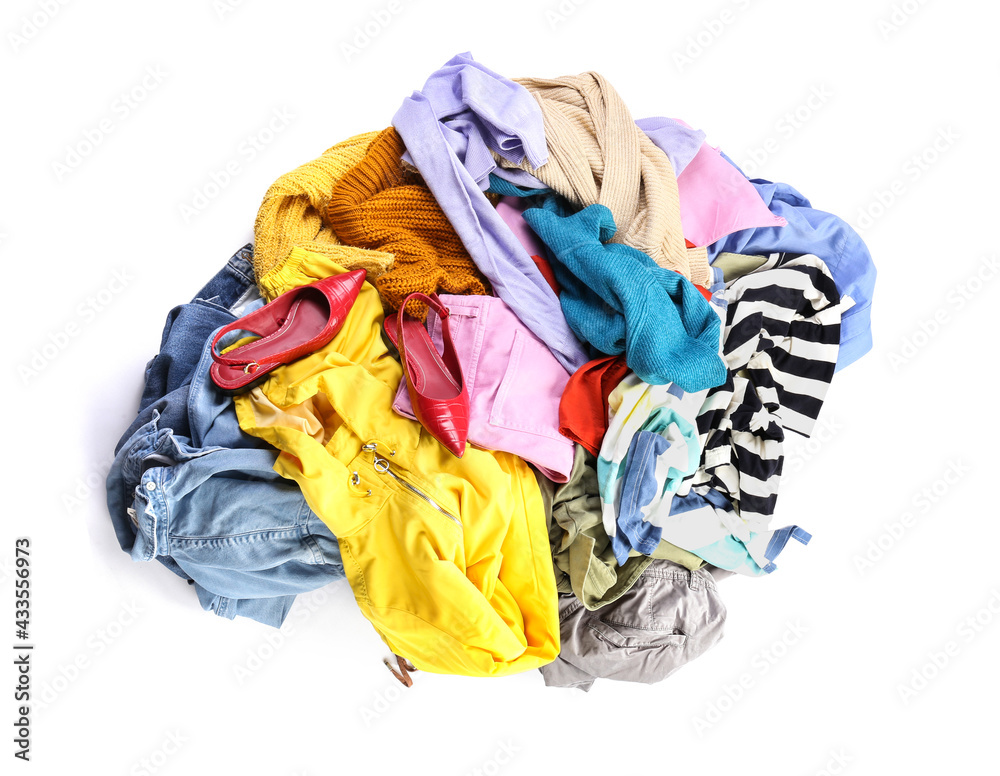 Heap of different clothes on white background