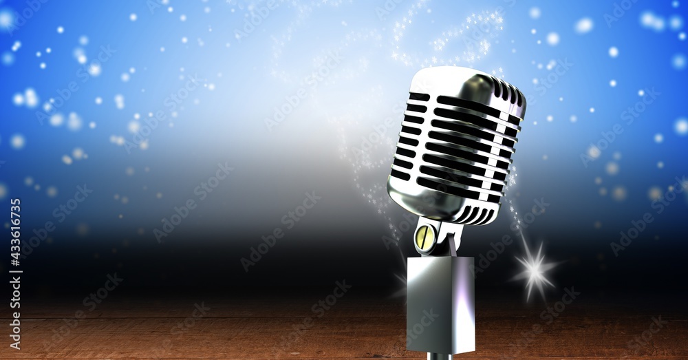 Vintage microphone on a stand over blue sparkling background, performance and holiday concepts