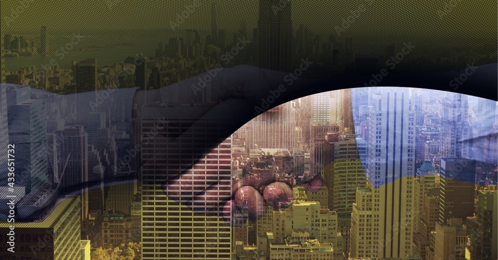 Composition of businessmen shaking hands over cityscape