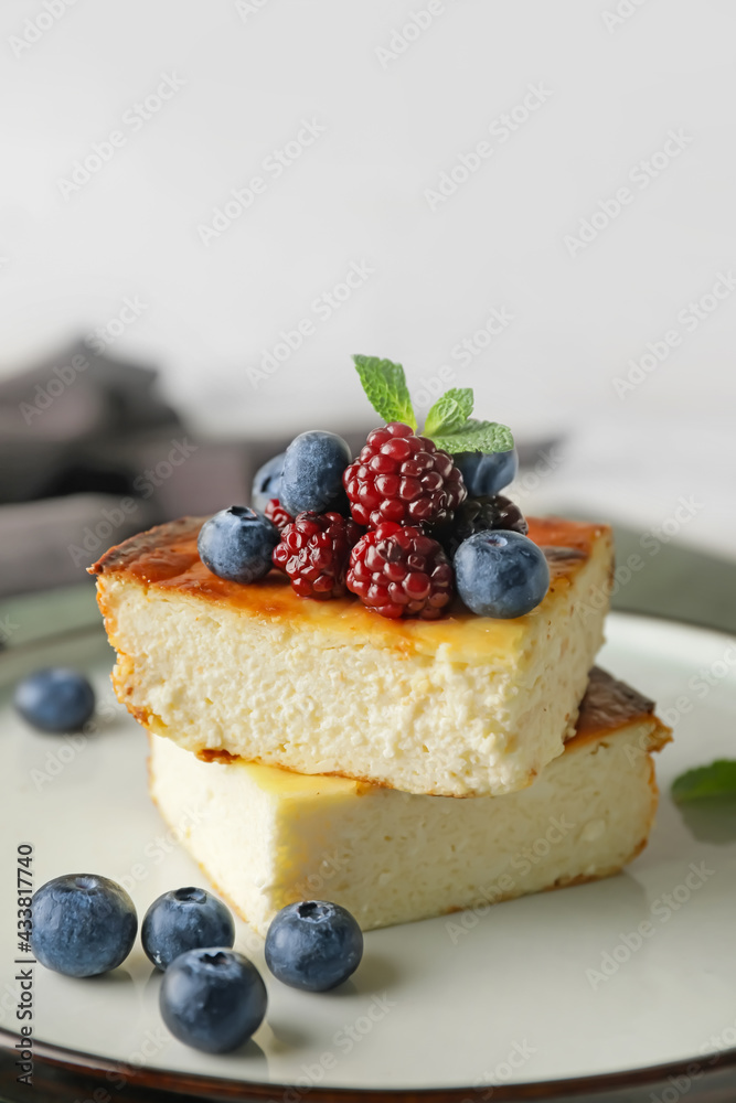 Plate with pieces of cottage cheese casserole on table, closeup