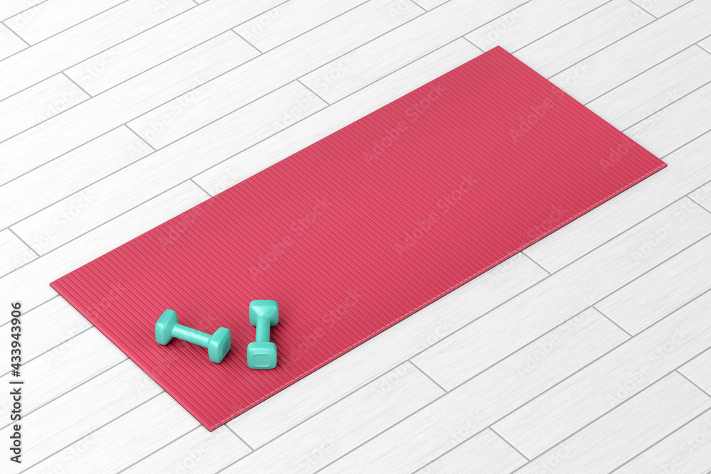 Two small dumbbells and rubber fitness mat on wood floor