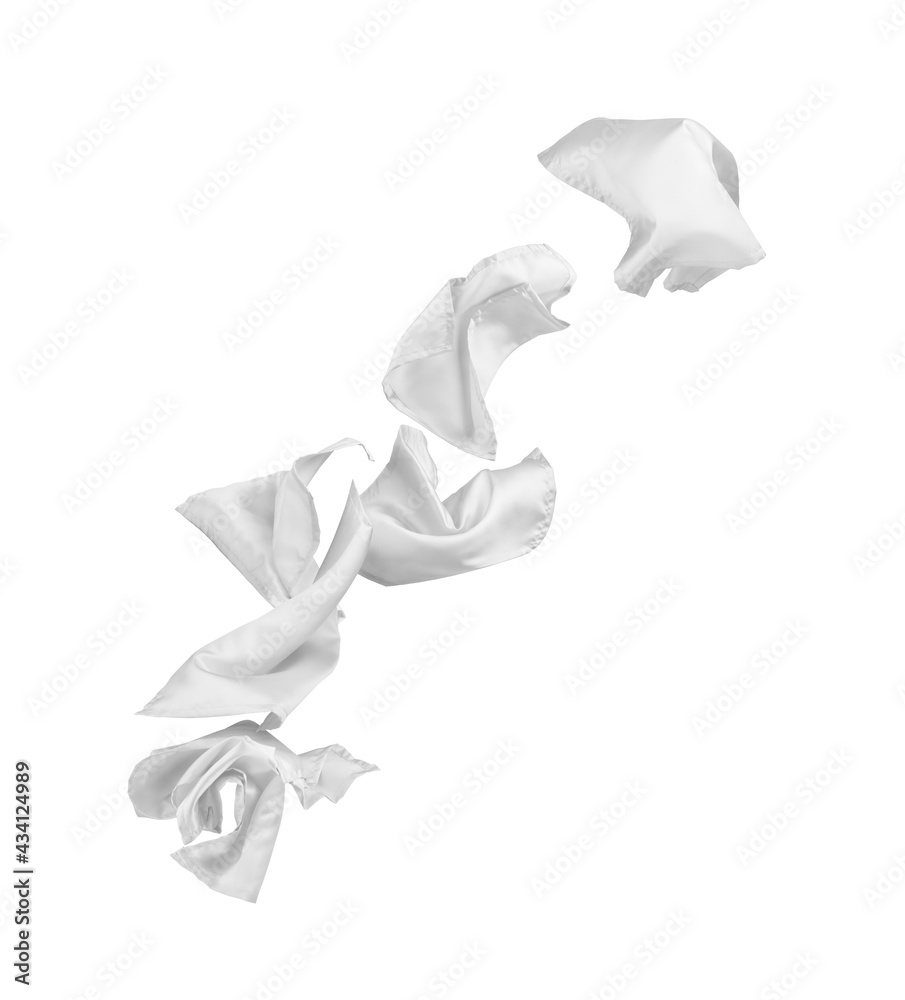 flying white pieces of fabric on a white background