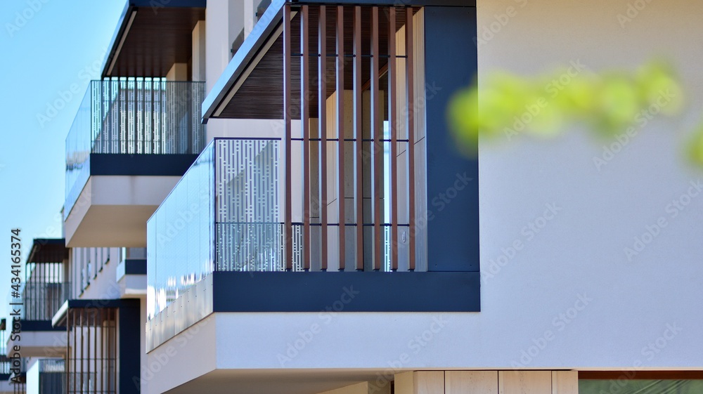 Condominium and apartment building with  symmetrical modern architecture. Detail in modern residenti