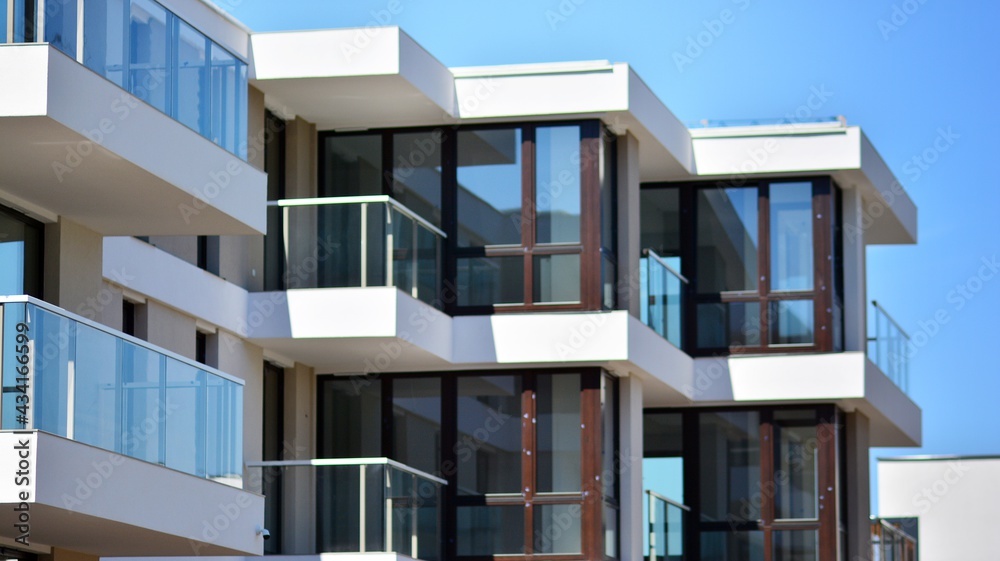 Condominium and apartment building with  symmetrical modern architecture. Detail in modern residenti