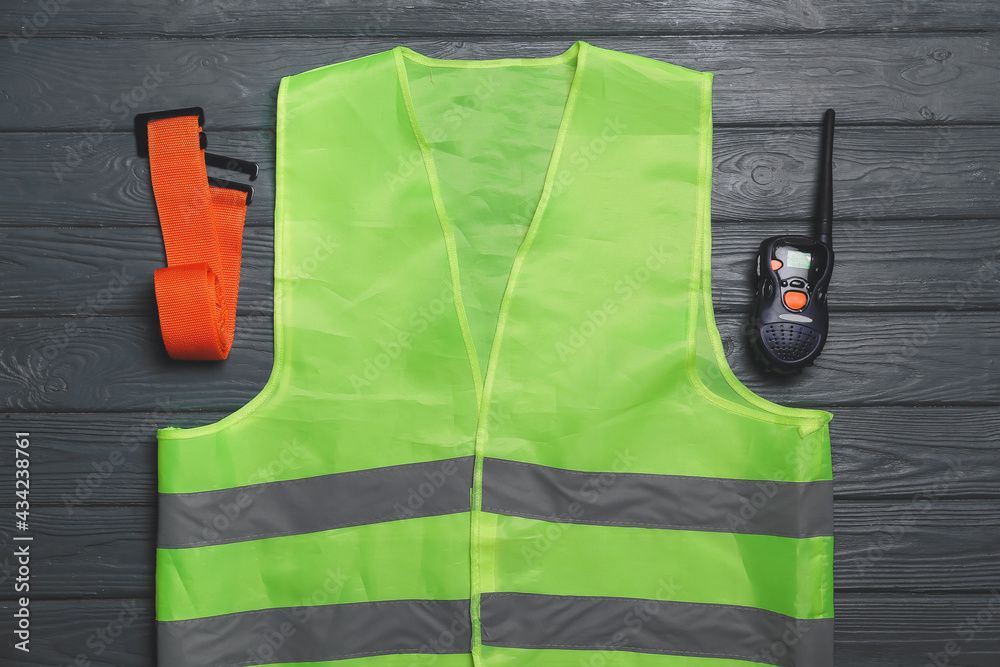 Safety equipment on dark wooden background