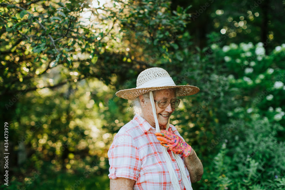 Happy senior woman in her garden