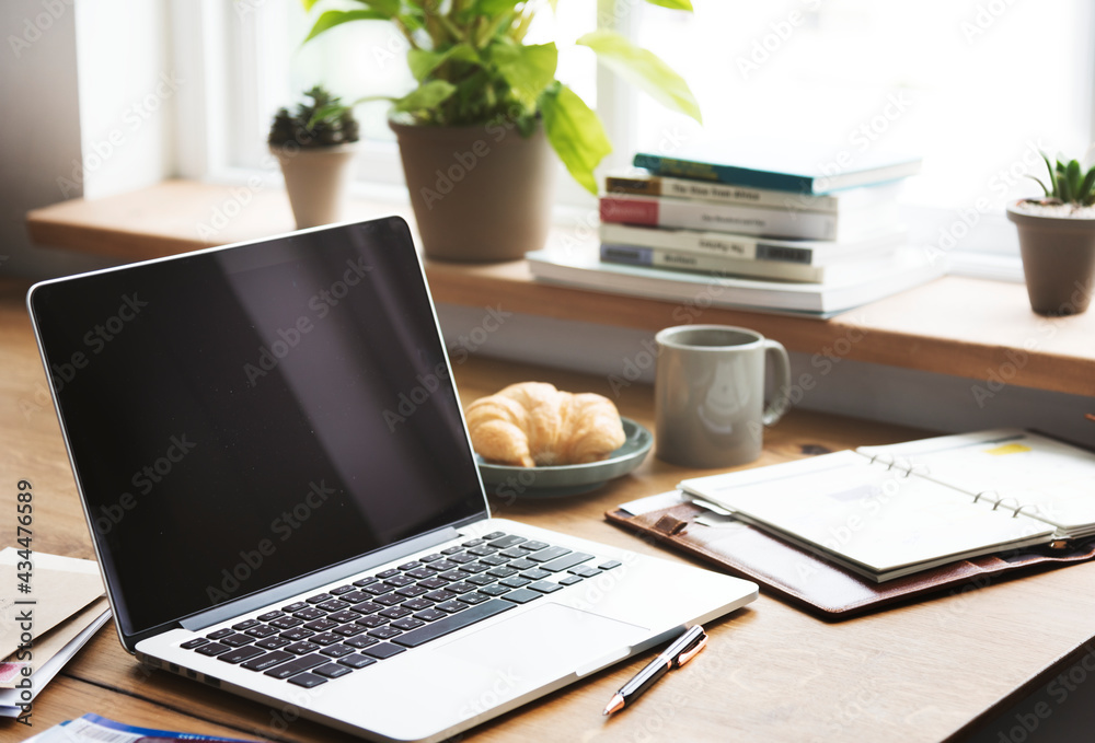 Laptop on a dinner table