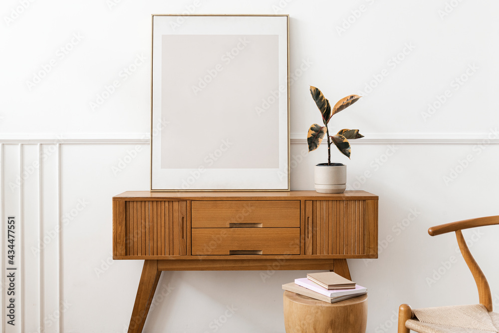 Picture frame on a wooden sideboard table