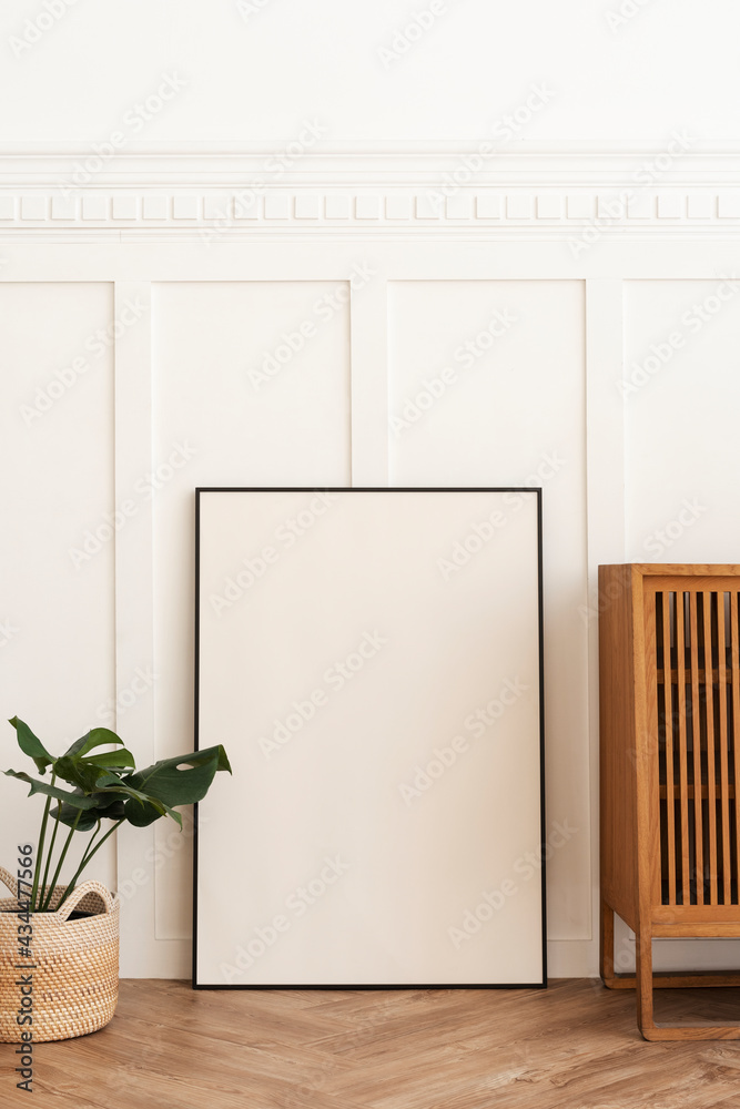 Blank picture frame on parquet floor