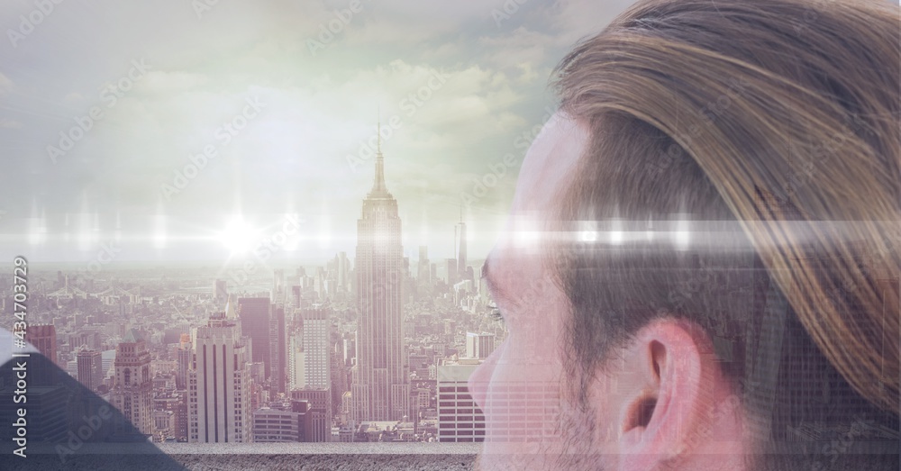 Spots of light over close up of businessman against cityscape in background