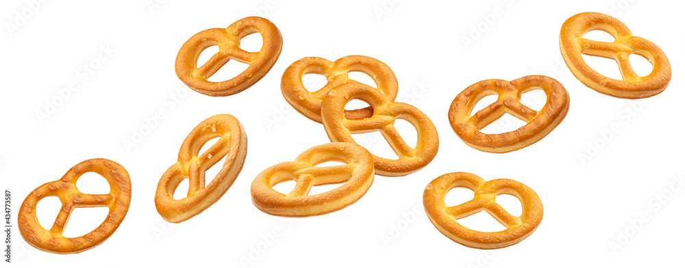 Falling salted pretzels isolated on white background