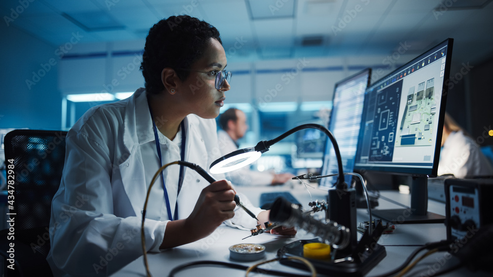 Modern Electronics Research, Development Facility: Black Female Engineer Does Computer Motherboard S