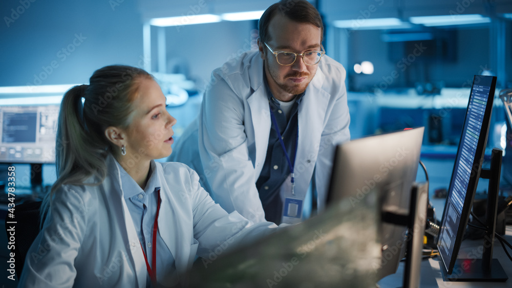 Electronics Research, Development Facility: Engineer Project Manager Consults Scientist working on C