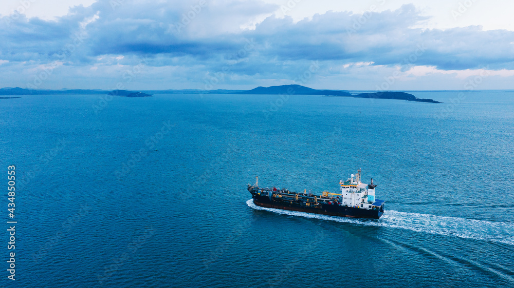 Ship sailing into Port Curtis at dawn, Gladstone, Queensland