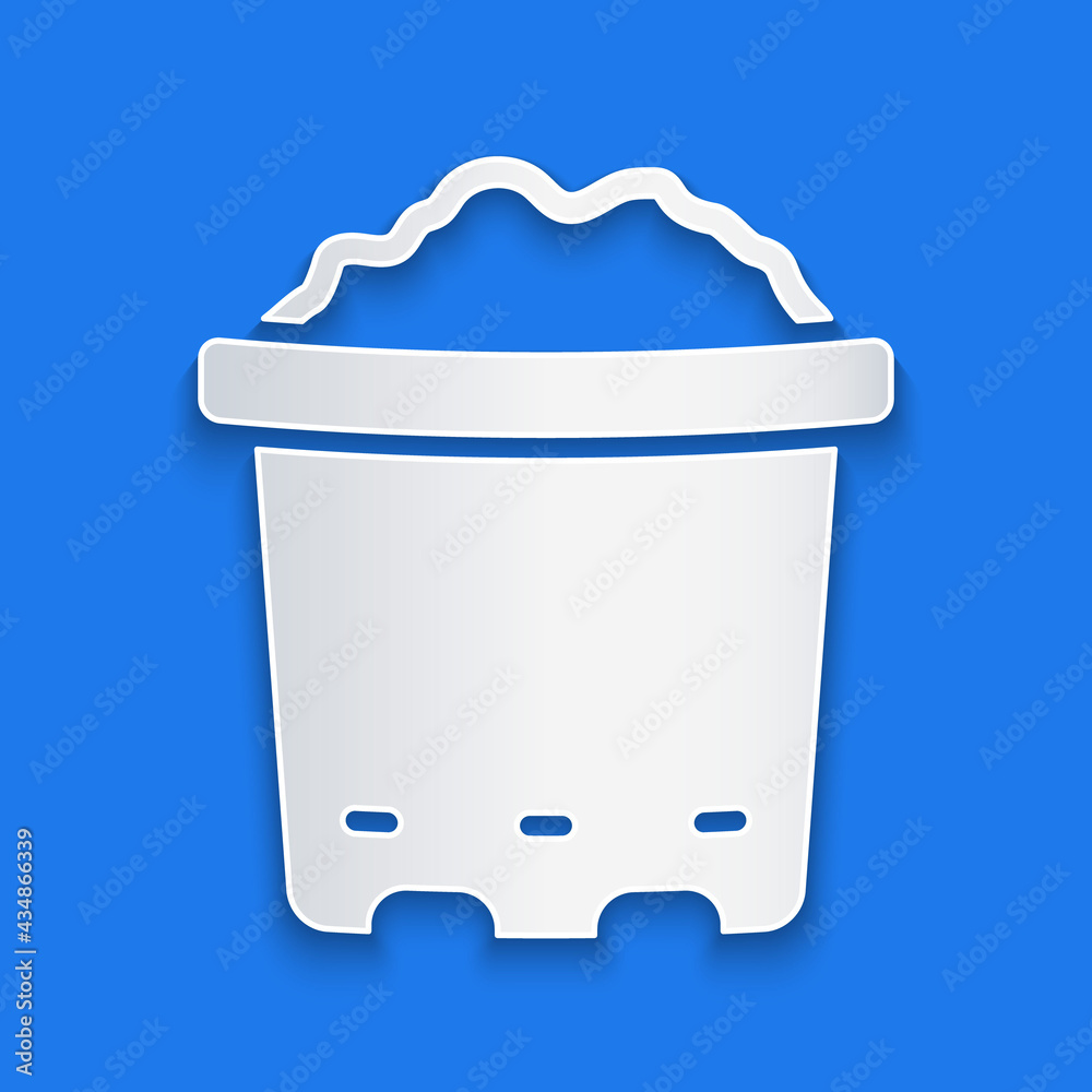 Paper cut Pot with soil icon isolated on blue background. Paper art style. Vector